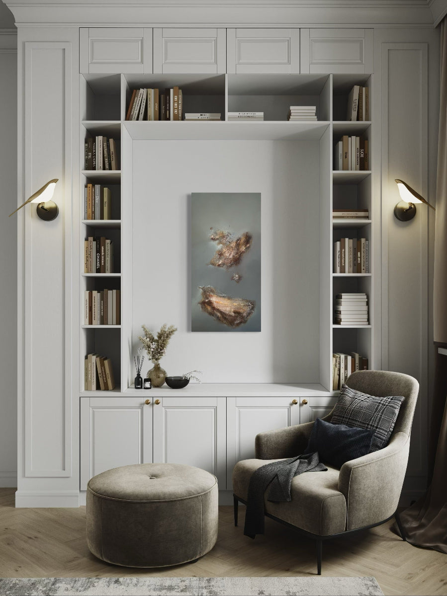 Modern living room with bookshelves, armchair, and ottoman.