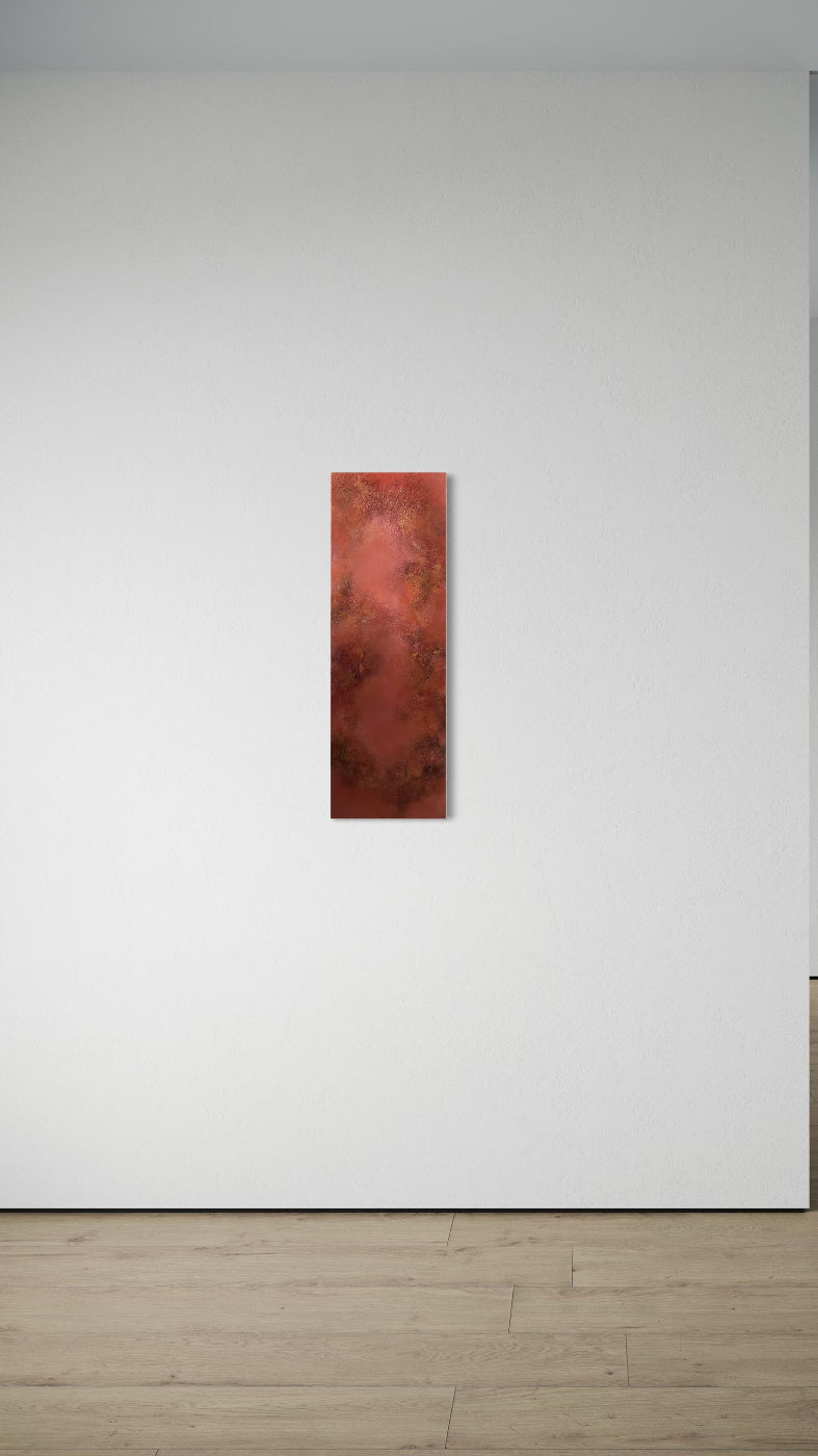 Red abstract painting on a white wall