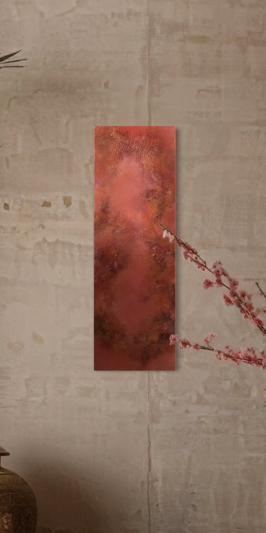 Rectangular red painting on a textured wall with a branch in the foreground