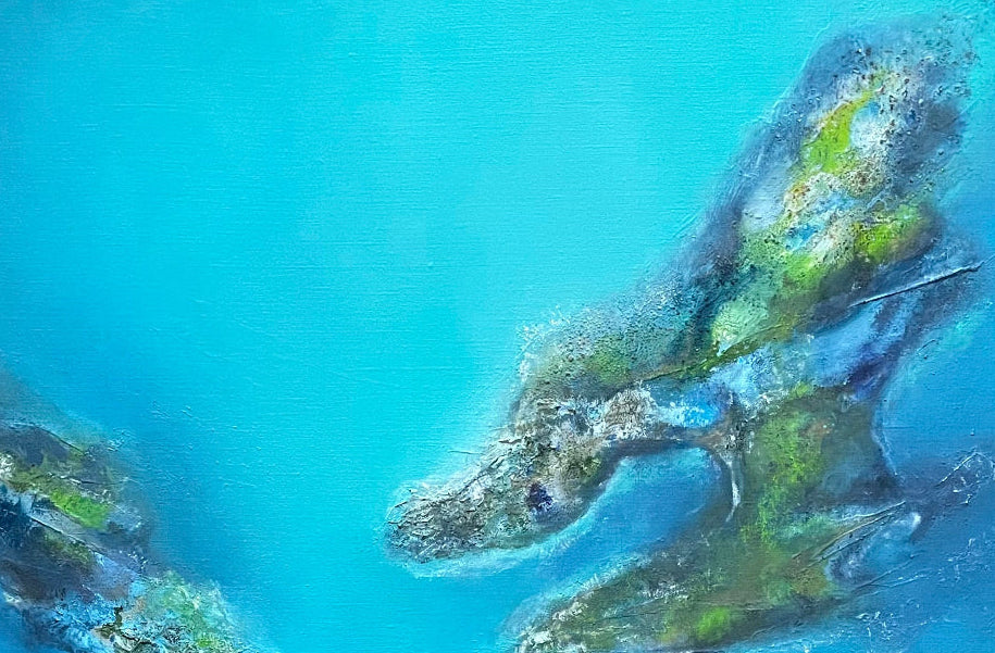 Two islands with green vegetation on a blue water background